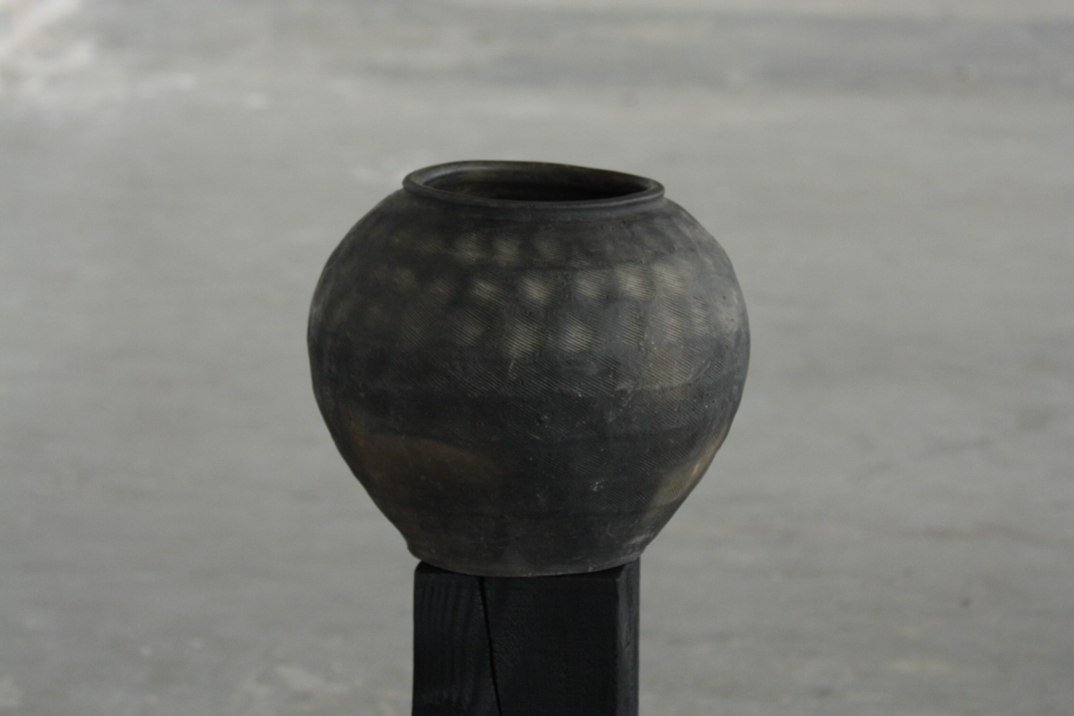 Unglazed textured vessel